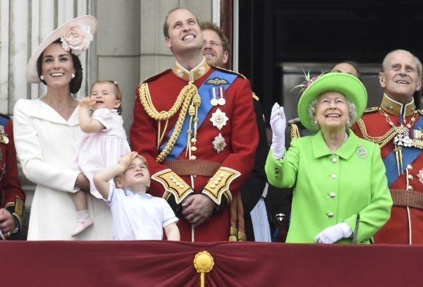 Members of the royal family, including Catherine, Duchess of Cambridge holding Princess Charlotte, Prince George, Prince William, Queen Elizabeth, and Prince Philip watch a flypast as they stand on the balcony of Buckingham Palace after the annual Trooping the Colour ceremony on Horseguards Parade in central London, Britain June 11, 2016. Trooping the Colour is a ceremony to honour Queen Elizabeth's official birthday. The Queen celebrates her 90th birthday this year. REUTERS/Toby Melville